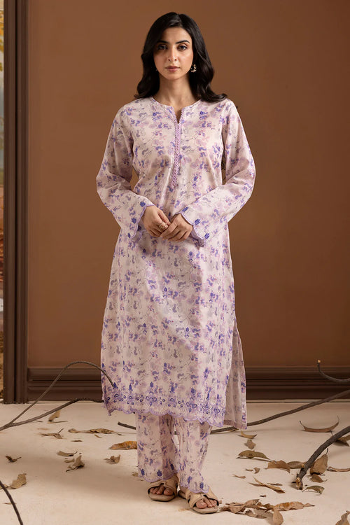 Woman wearing a floral kurta with a brown background